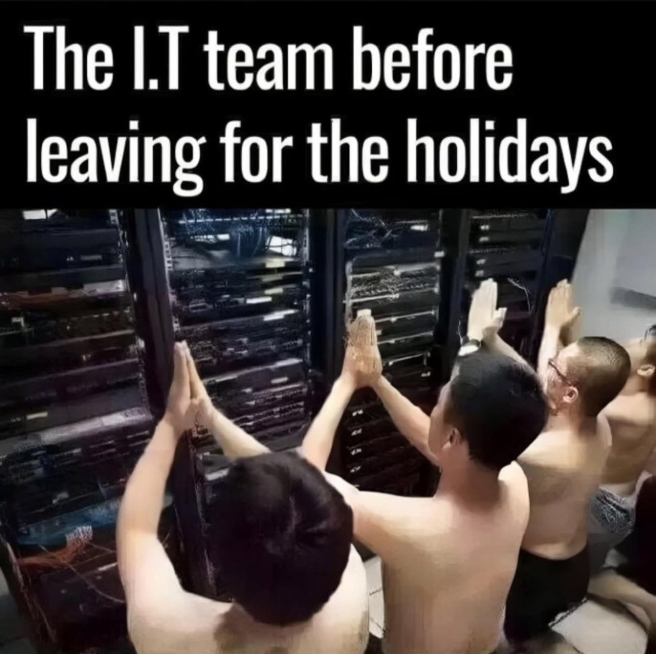Four shirtless people kneeling and praying in front of server racks with text saying 'The I.T team before leaving for the holidays'.